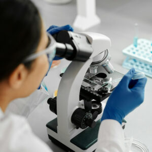 Scientist and microscope